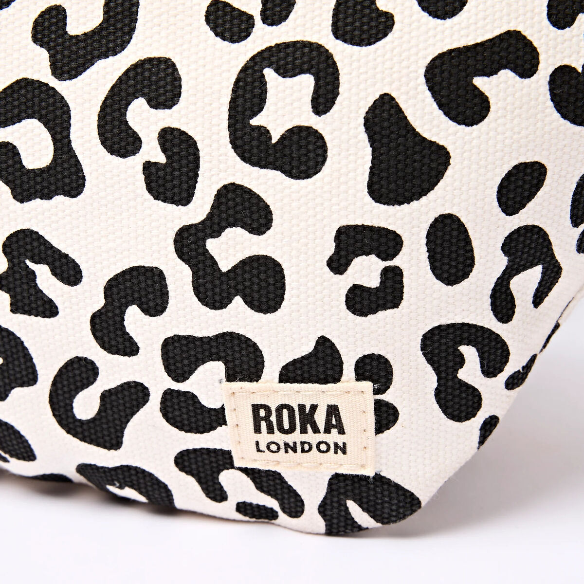 ROKA_MILL_HILL_SMALL_SUMMER_LEOPARD_LABEL.webp